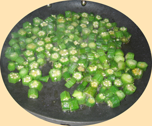 Okra cooking on pan on stove